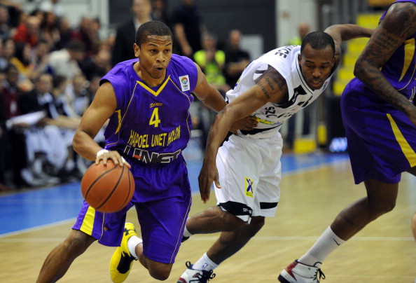 US Dominic Waters (L) of Hapoel Unet Holon fights for the ball with James Florance (R) of KK Szolnoki Olaj in Szolnok on February 19, 2013 during their FIBA Group L EuroChallenge round of 16 match. AFP PHOTO / ATTILA KISBENEDEK        (Photo credit should read ATTILA KISBENEDEK/AFP/Getty Images)