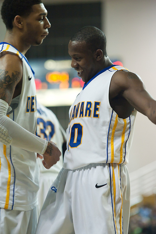 Delaware Sophomore Guard #10 Devon Saddler and Delaware Junior Forward #44 Jamelle Hagins chest bump each other during a Colonial Athletic Association conference Basketball Game against UNCW